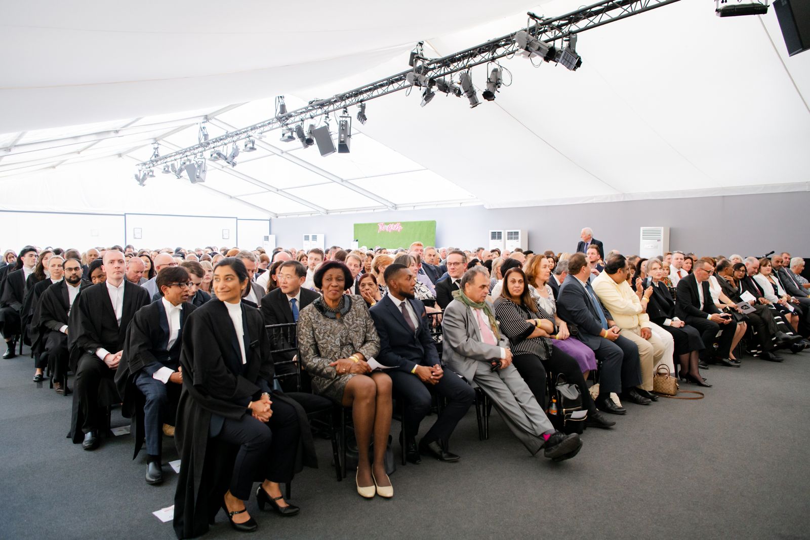 Audience at formal legal event